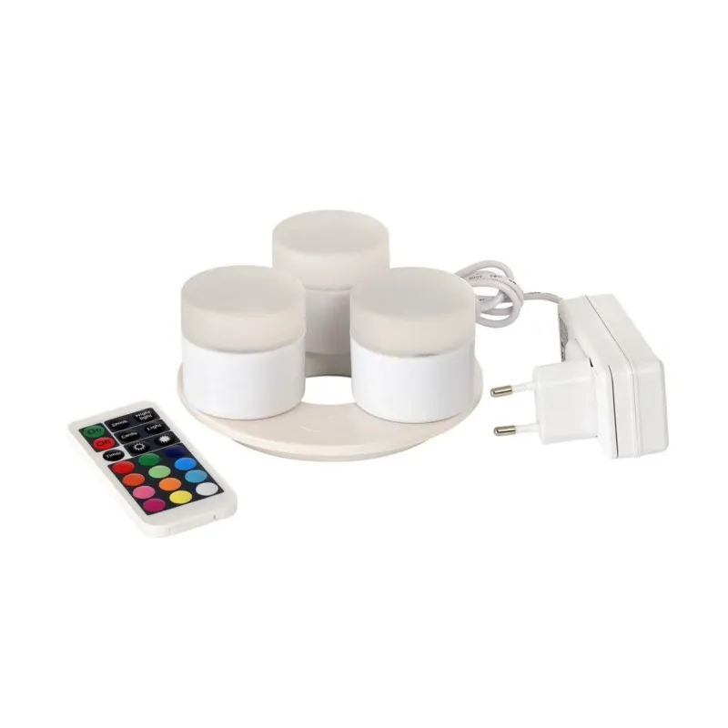 Das Duni GmbH Mini Multicolour LED Set beinhaltet drei kleine, runde LEDs mit einer Ladestation, einem weißen Netzteil und einer Fernbedienung für verschiedene Farben und Funktionen - perfekt für kreative Beleuchtung.